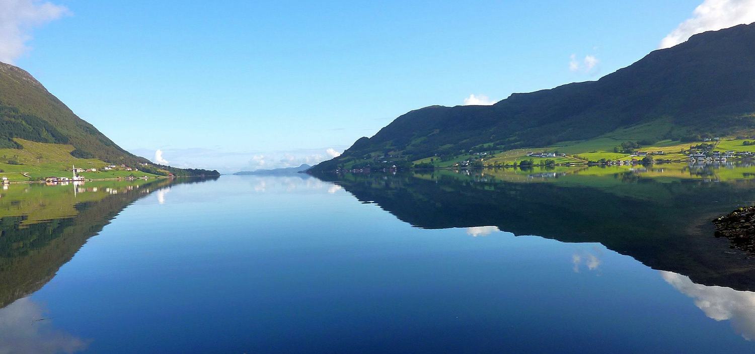 A Northern Europe yacht charter offers stll water and blue skies